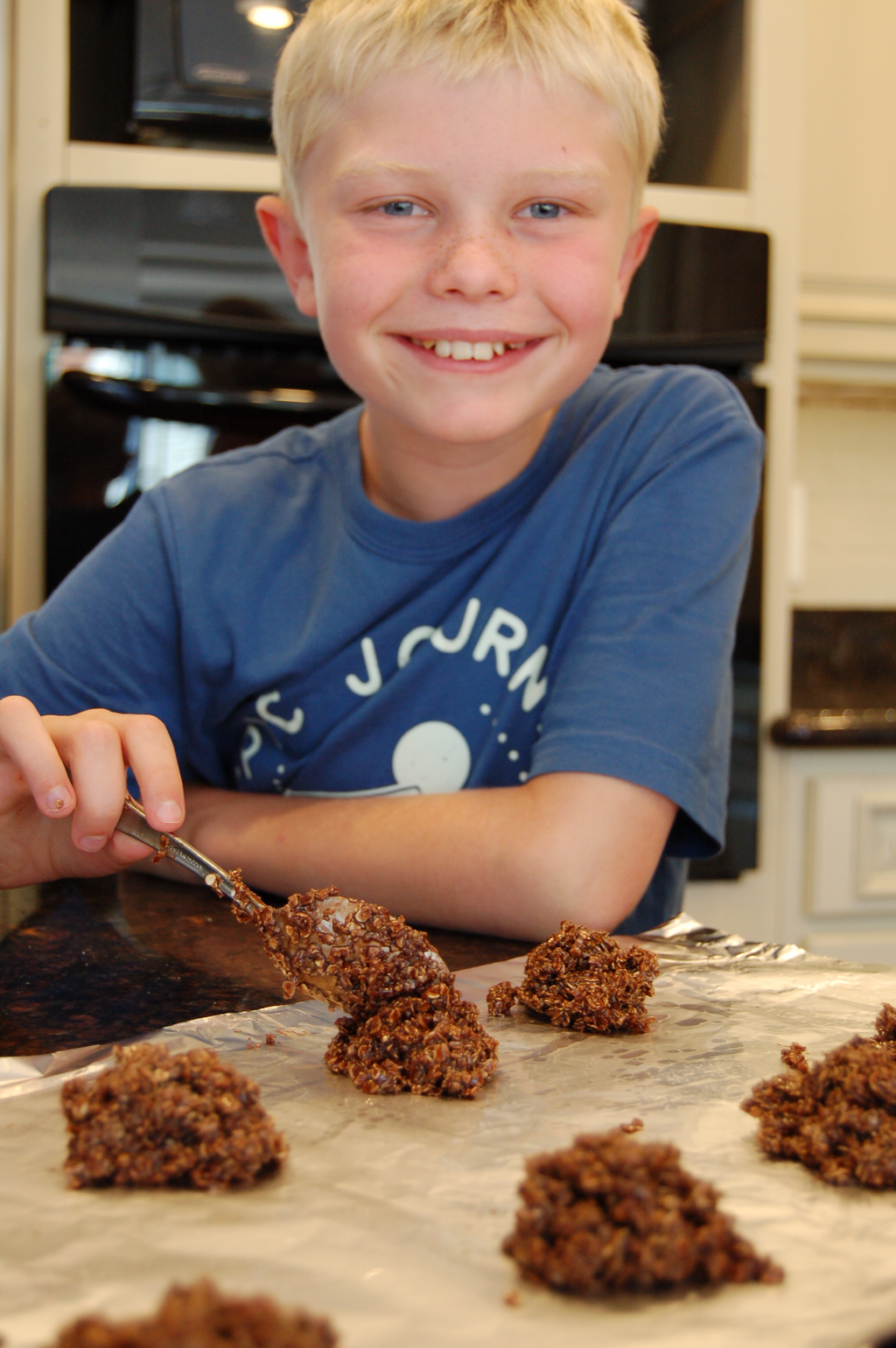 Noah forming chocolate drop cookies