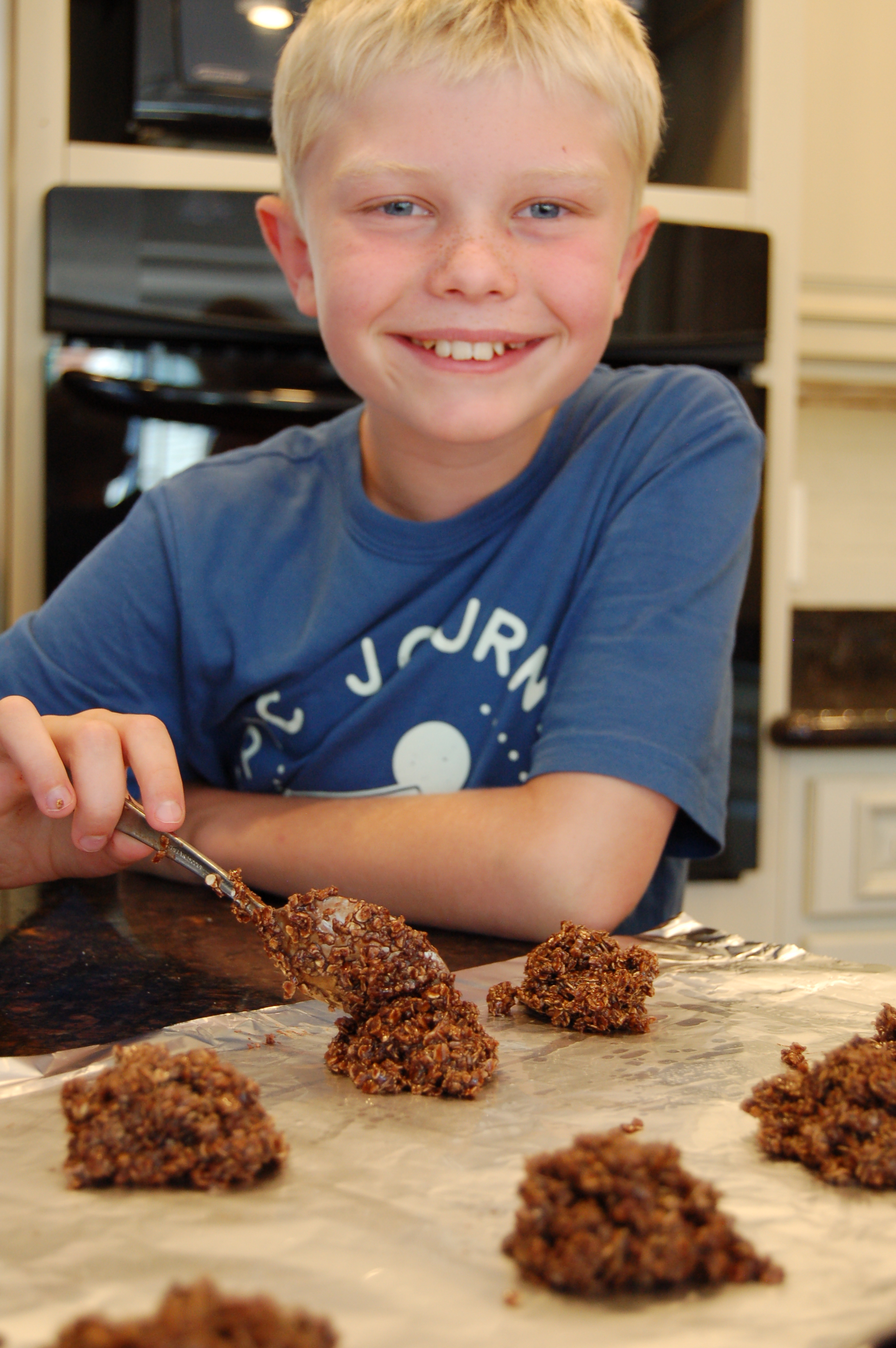 Noah forming chocolate drop cookies