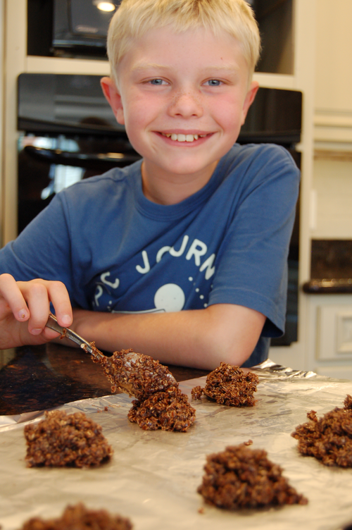 Noah forming chocolate drop cookies